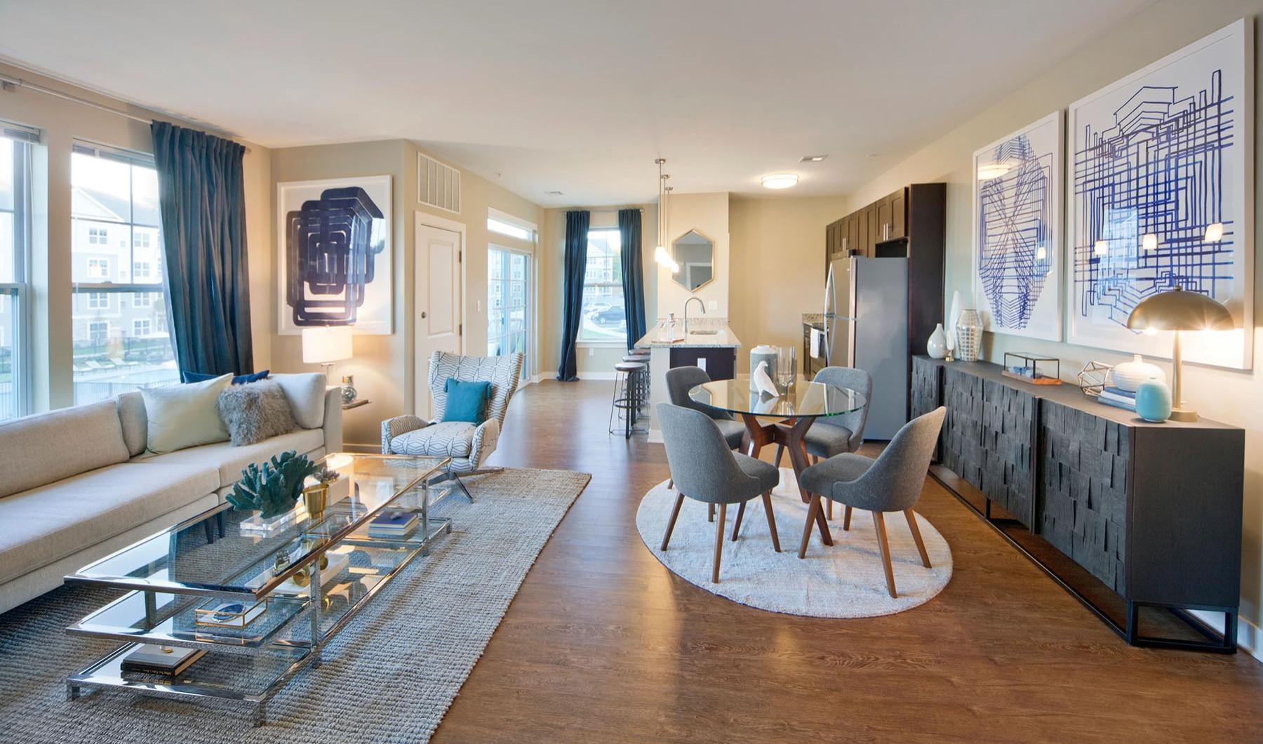 a living room with table and chairs