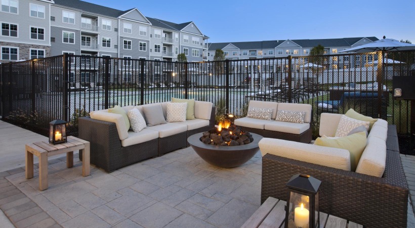 outside seating area with a fire pit.