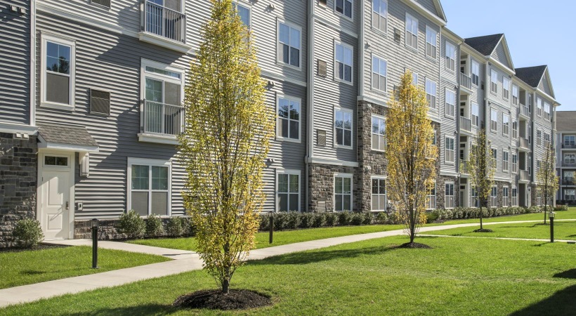 a building with trees in front