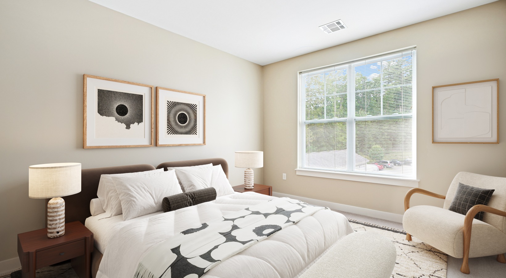 Bedroom with bed, chair, and end tables.