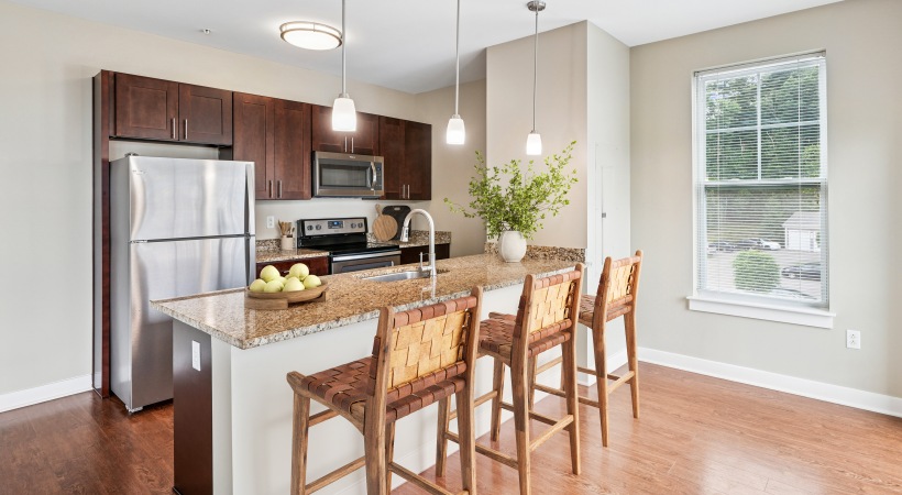 Kitchen with island and barstools at Parc Westborough, a premier apartments in Westborough, MA.