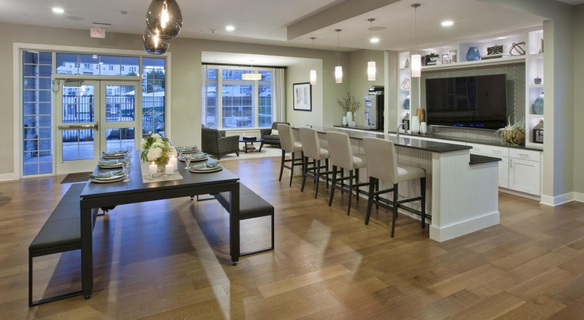 clubhouse with a large dining table and a large window