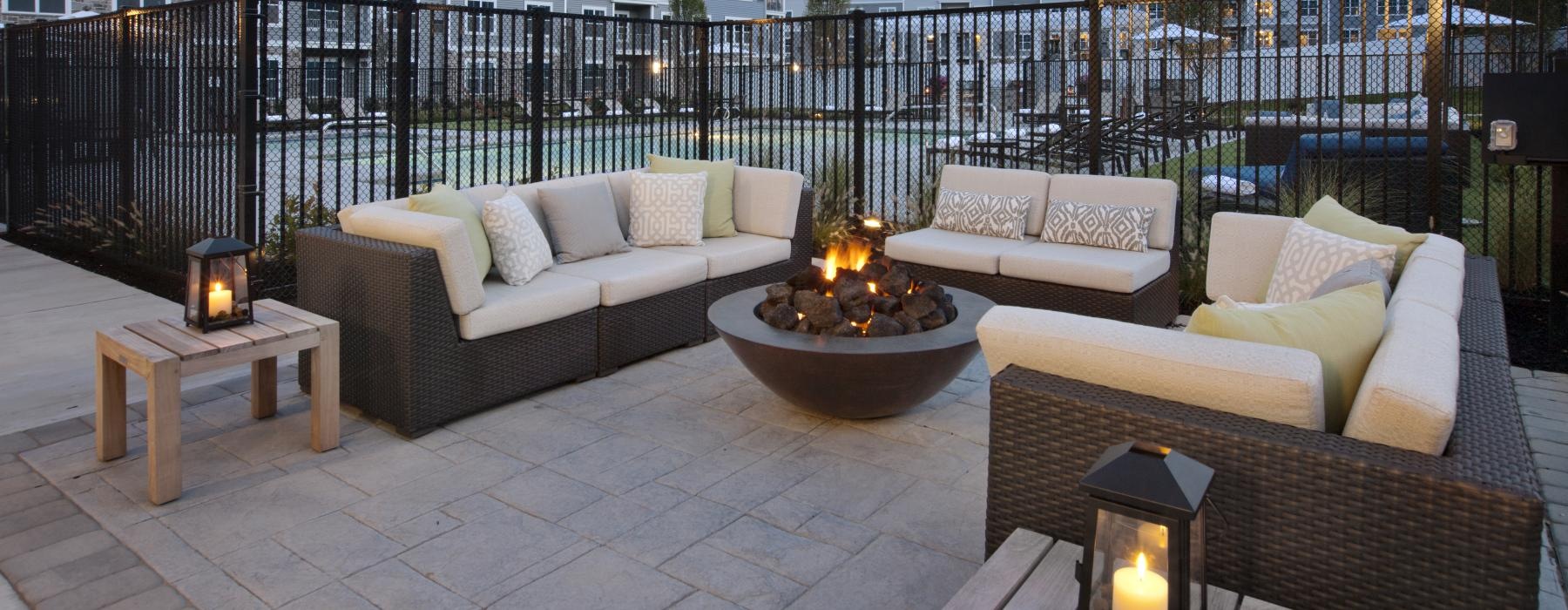 outside seating area with a fire pit.